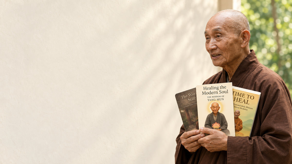 Yang Mun holding his three books